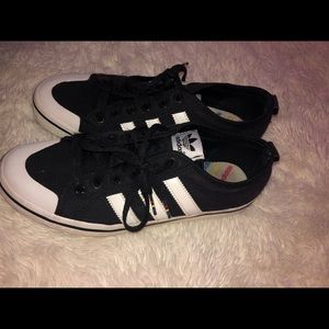 Size 8 women’s addidas superstar black white strip